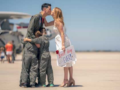 POINT MUGU, Calif. (Aug. 9, 2022) – Lt. Cmdr. Carlos Molina, assigned to the "Wallbangers" Airborne Command and Control Squadron (VAW) 117, is greeted by his family following a seven-month deployment to U.S. 3rd Fleet and 7th Fleet areas of operations with Carrier Air Wing (CVW) 9, embarked aboard USS Abraham Lincoln (CVN 72). CVW-9 deployed with a combination of fourth and fifth-generation platforms that predominantly represent the “Airwing of the Future,” executing more than 21,307 fixed-wing and helicopter flight hours comprising of 10,250 sorties, 8,437 launches and 8,487 aircraft arrestments. U.S. Navy photo by Ens. Drew Verbis.