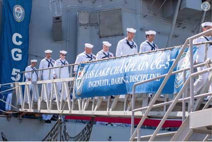 SAN DIEGO (Sep. 01, 2023) – The crew of the Ticonderoga-class guided-missile cruiser USS Lake Champlain (CG 57), disembark the ship during a decommissioning ceremony. Lake Champlain was decommissioned after more than 35 years of distinguished service. Commissioned Aug. 12, 1988, Mobile Bay served in the U.S. Pacific Fleet and supported Operation Desert Shield, Operation Desert Storm, and the support of global war on terrorism. (U.S. Navy photo by Mass Communication Specialist 2nd Class Stevin C. Atkin