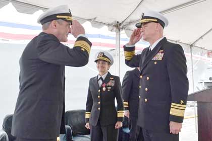 NAVAL BASE SAN DIEGO (Dec. 21, 2023) - Vice Adm. Blake L. Converse, Deputy Commander, U.S. Pacific Fleet, left, returns the salute of Vice Adm. Brendan R. McLane, Commander, Naval Surface Forces, right, as he relieves Rear Adm. Yvette Davids during a change of command ceremony Dec. 21. Commander, Naval Surface Force, U.S. Pacific Fleet’s mission is to man, train, and equip the surface force to provide fleet commanders with credible naval power to control the sea and project power ashore. U.S. Navy photo by MC1 Claire M. DuBois