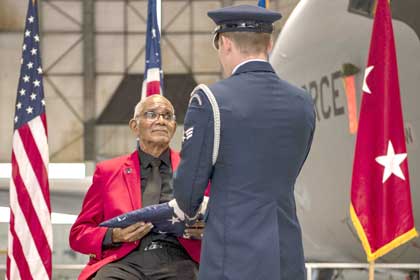 Tuskegee Tribute: Retired Sgt. Thomas Newton, a Tuskegee Airman, is honored during a ceremony celebrating the 75th anniversary of desegregation in the U.S. military at Rickenbacker Air National Guard Base, Ohio, Dec. 2, 2023.