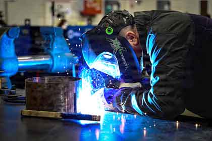 Air Force Tech Sgt. Joseph Winke, a metals technology specialist assigned to the 513th Maintenance Squadron, welds a cylindrical metal section during training at Tinker Air Force Base, Okla., last week. Photo by Air Force Senior Airman Caroline Strickland.