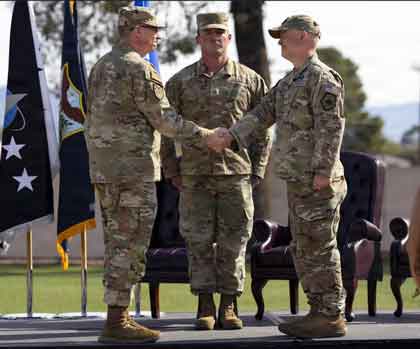 Air Force Lt. Gen. Evan L. Pettus, left, U.S. Southern Command acting commander, shakes hands with Space Force Col. Brandon Alford, right, U.S. Space Forces Southern commander, during an activation ceremony for U.S. Space Forces Southern at Davis-Monthan Air Force Base, Ariz., Jan. 21, 2026. The command serves as the space component to Southcom, responsible for integrating space power with joint, interagency and multinational partners to support regional security, deterrence and stability across Central America, South America and the Caribbean.Photo credit: Air Force Tech. Sgt. Rachel Maxwell 