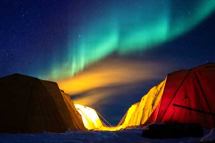Operation ICE CAMP 2026: BEAUFORT SEA, Arctic Circle - The northern lights appear over Ice Camp Boarfish during Operation ICE CAMP 2026, Mar. 14. ICE CAMP Boarfish is a three-week operation designed to research, test, and evaluate operational capabilities in the Arctic region. In addition to U.S. Navy, U.S. Marine Corps, and Air National Guard participation, personnel from the Royal Australian Navy, Royal Canadian Navy, Royal Canadian Air Force, French Navy, Royal Navy, Norwegian Defence Research Institute, and the Japan Agency for Marine-Earth Science and Technology are also taking part. This operation, held biennially, partners with the ASL and was elevated from an exercise to an operation to better reflect the Navy&rsquo;s strategic priorities in the Arctic. ICE CAMP provides the necessary training to maintain a working knowledge of a constantly changing region. U.S. Navy photo by MC1 Bryan Mai.
